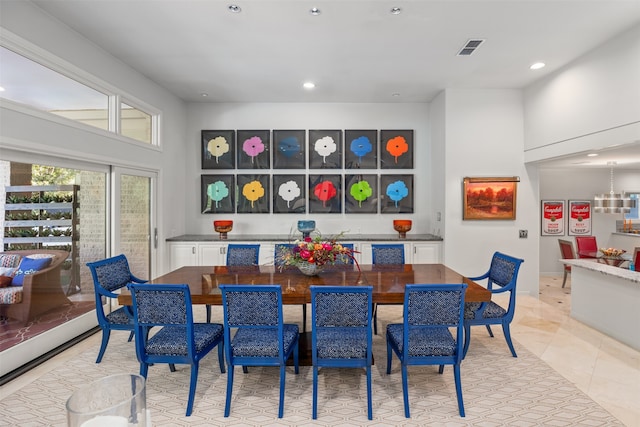 dining space featuring light tile patterned floors