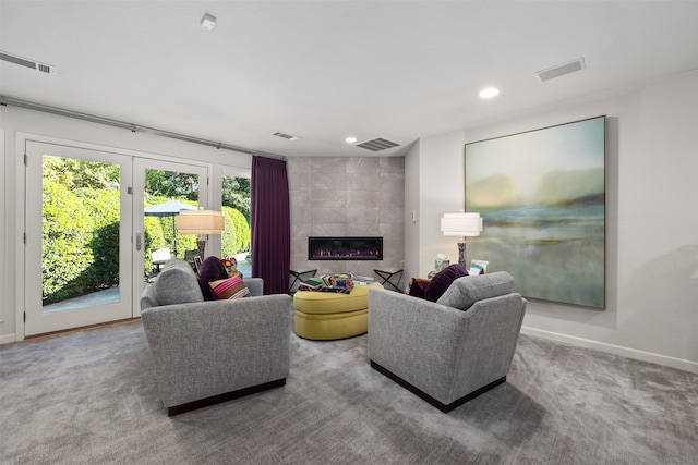 carpeted living room featuring a fireplace