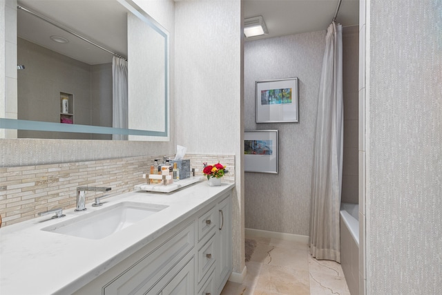 bathroom featuring vanity, tasteful backsplash, and shower / bathtub combination with curtain