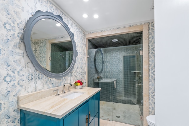 bathroom with vanity, an enclosed shower, and toilet