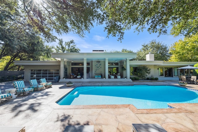 view of swimming pool with a patio