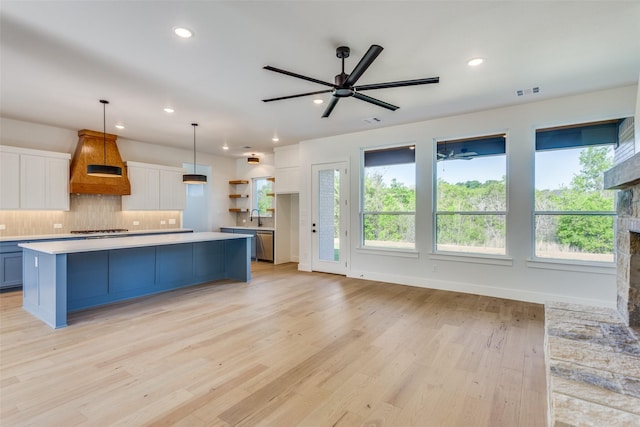 505 Aermotor Loop, Weatherford, TX 76085 - kitchen featuring custom exhaust hood, stainless steel dishwasher, white cabinetry, light countertops, and ceiling fan
