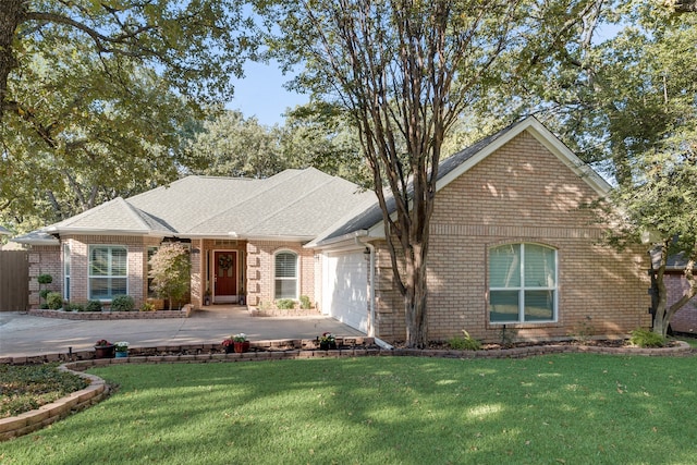 ranch-style house with a front yard and a garage