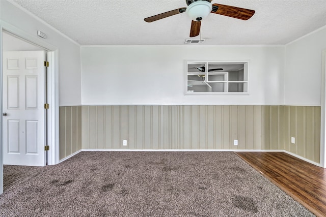 spare room featuring a textured ceiling, hardwood / wood-style flooring, and ceiling fan