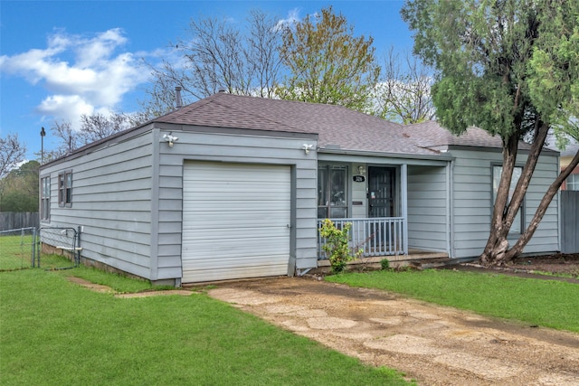 view of front facade featuring a front lawn and a garage