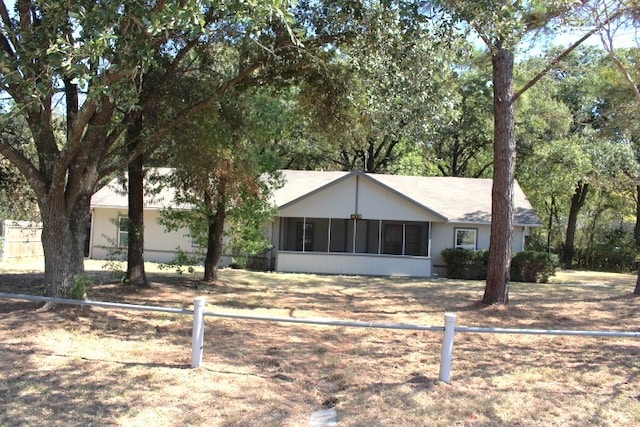 view of front facade featuring a sunroom