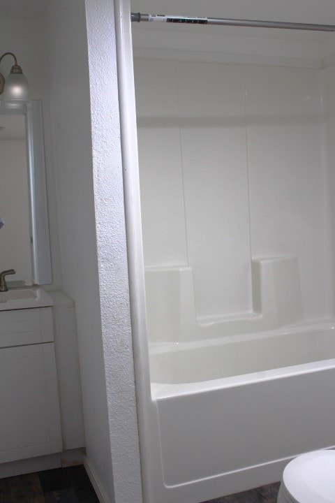 full bathroom featuring vanity, toilet, and shower / bathtub combination