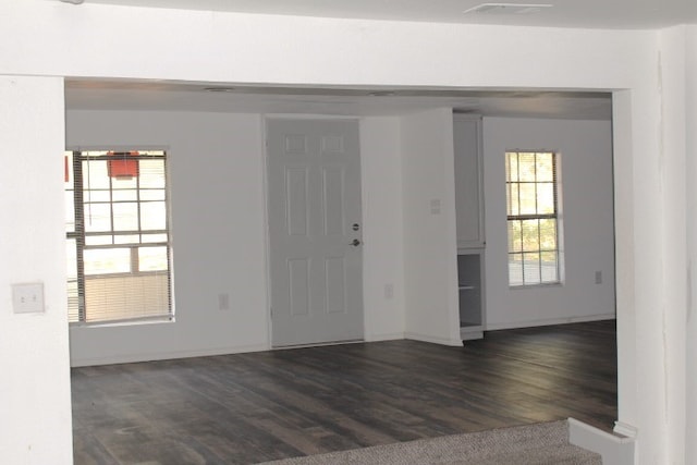 entrance foyer with dark hardwood / wood-style floors