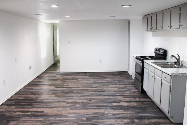 kitchen featuring dark hardwood / wood-style flooring, sink, gray cabinets, and electric stove