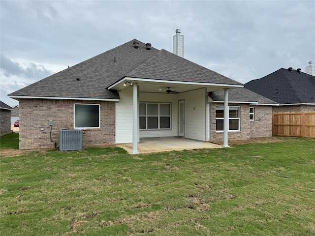 rear view of house featuring central AC, a yard, a patio, and ceiling fan