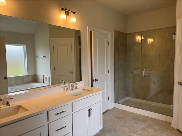 bathroom with vanity, tile patterned floors, and shower with separate bathtub