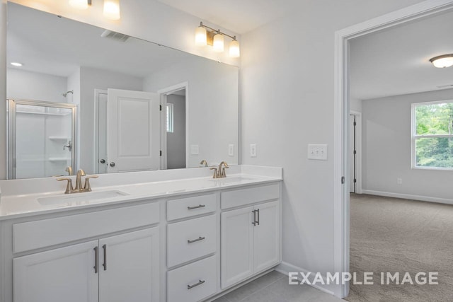 bathroom with vanity and an enclosed shower