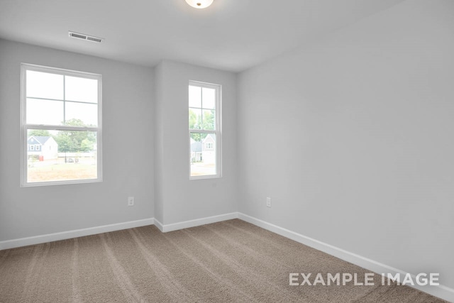 unfurnished room featuring carpet flooring