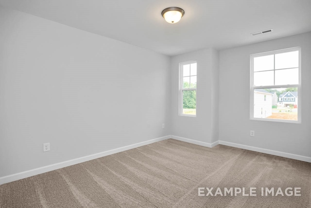 empty room with carpet flooring