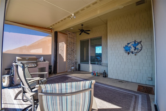 view of patio with a grill and ceiling fan