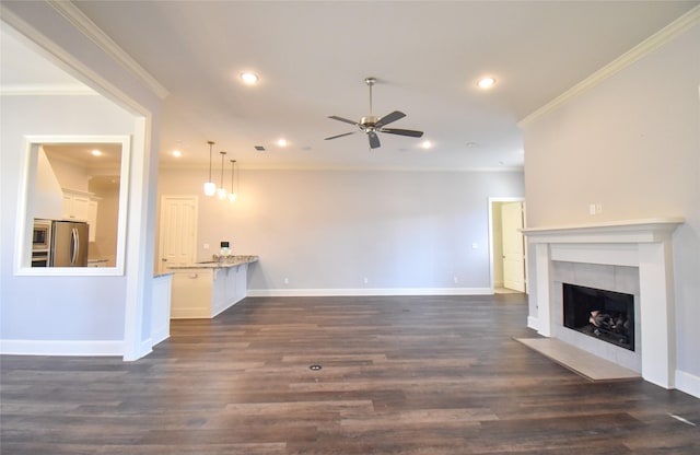 unfurnished living room with ornamental molding and dark hardwood / wood-style floors