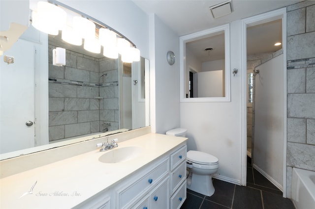 full bathroom featuring vanity, toilet, tiled shower / bath combo, and tile patterned flooring