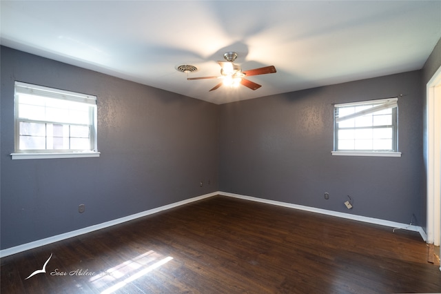 empty room featuring ceiling fan and dark hardwood / wood-style floors