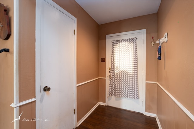 corridor with dark hardwood / wood-style floors