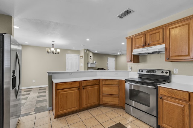 kitchen featuring pendant lighting, appliances with stainless steel finishes, light tile patterned floors, and kitchen peninsula