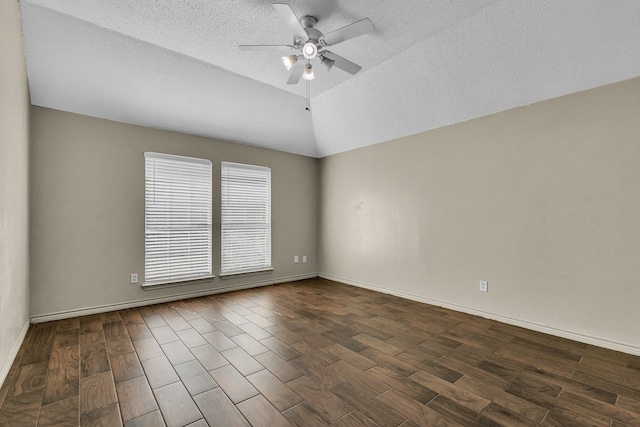 unfurnished room with ceiling fan, a textured ceiling, lofted ceiling, and dark hardwood / wood-style flooring