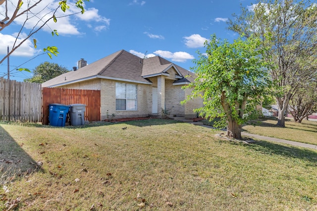 view of home's exterior with a lawn