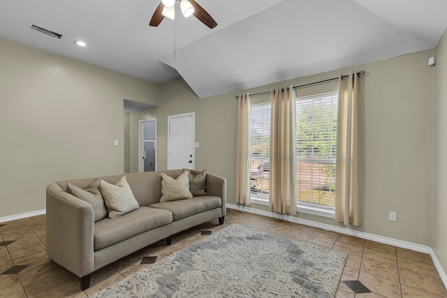 tiled living room with lofted ceiling and ceiling fan