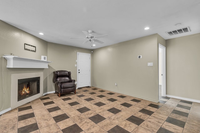 unfurnished room with tile patterned floors and ceiling fan