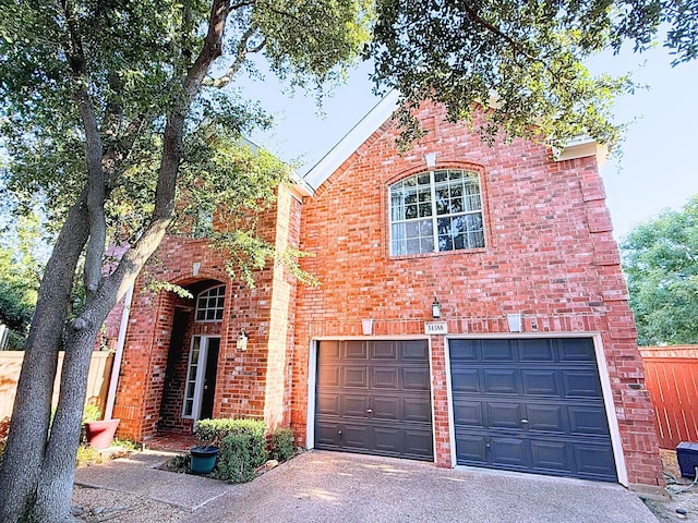 tudor-style house featuring a garage