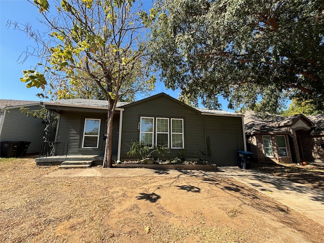 ranch-style home featuring driveway