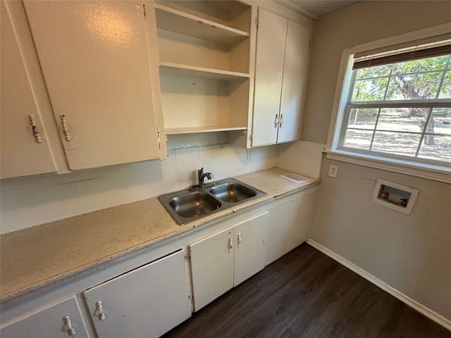 kitchen featuring sink, white cabinets, and dark hardwood / wood-style flooring