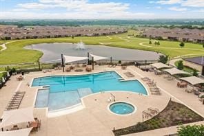 view of pool featuring a hot tub and a patio area