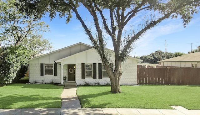 ranch-style home with a front lawn