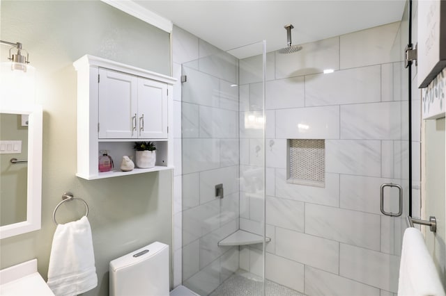 bathroom featuring walk in shower, vanity, and toilet