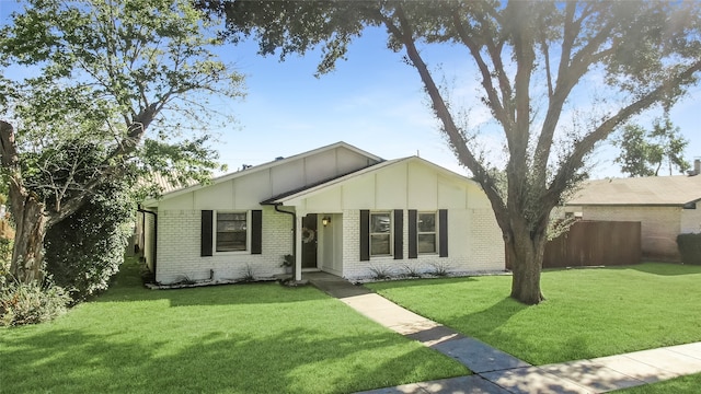 single story home featuring a front yard