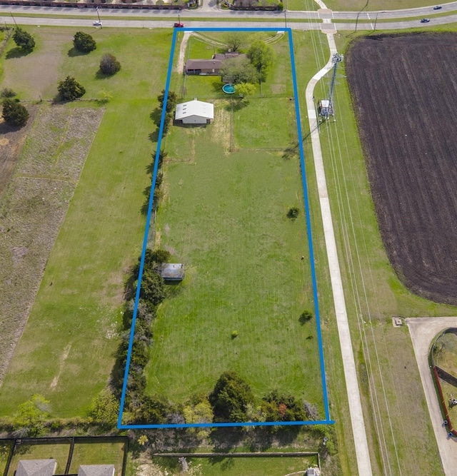 birds eye view of property featuring a rural view