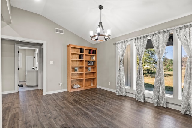 interior space with lofted ceiling, dark hardwood / wood-style floors, and plenty of natural light