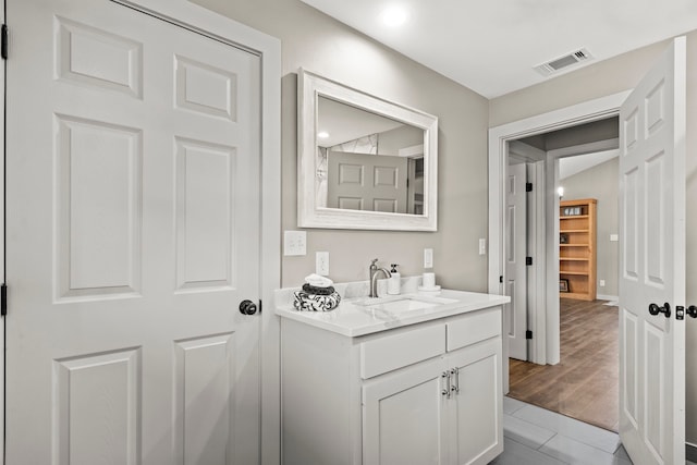 bathroom featuring vanity and wood-type flooring