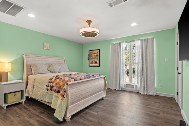 bedroom featuring dark wood-type flooring