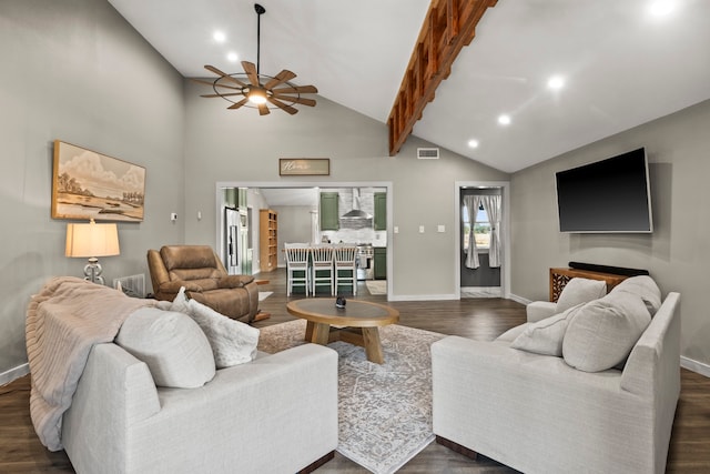 living room featuring ceiling fan, high vaulted ceiling, beamed ceiling, and dark hardwood / wood-style floors