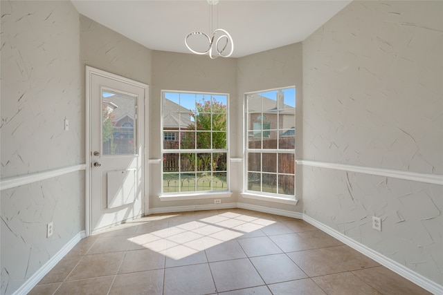 unfurnished dining area featuring light tile patterned floors