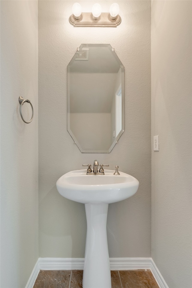 bathroom with tile patterned floors and sink