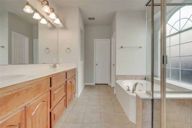 bathroom featuring vanity, tile patterned floors, and separate shower and tub