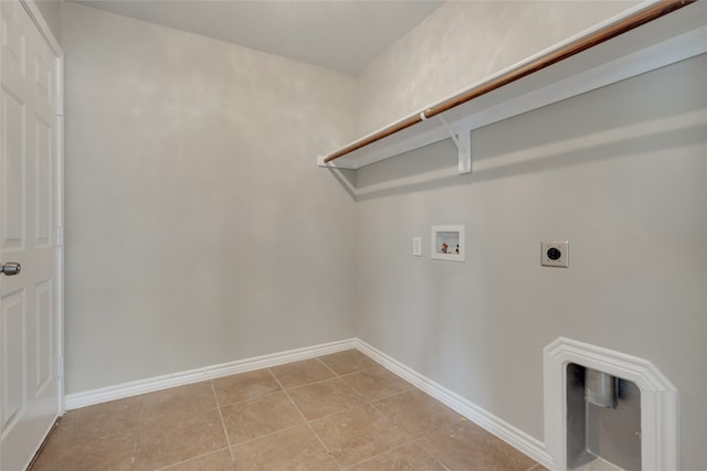 washroom with hookup for a washing machine, electric dryer hookup, and light tile patterned flooring