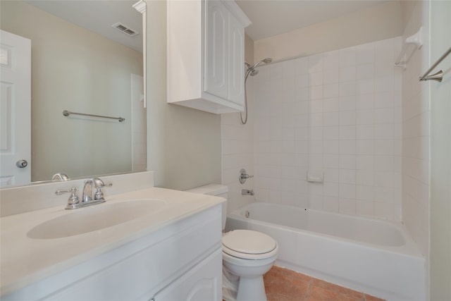 full bathroom with vanity, tiled shower / bath combo, toilet, and tile patterned floors