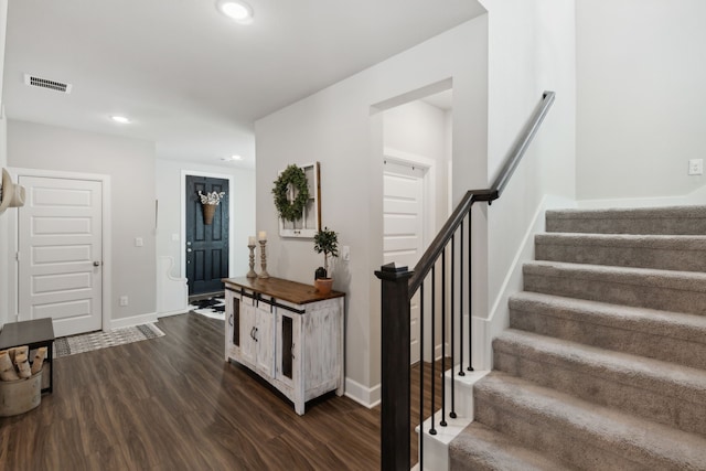 stairway with hardwood / wood-style flooring