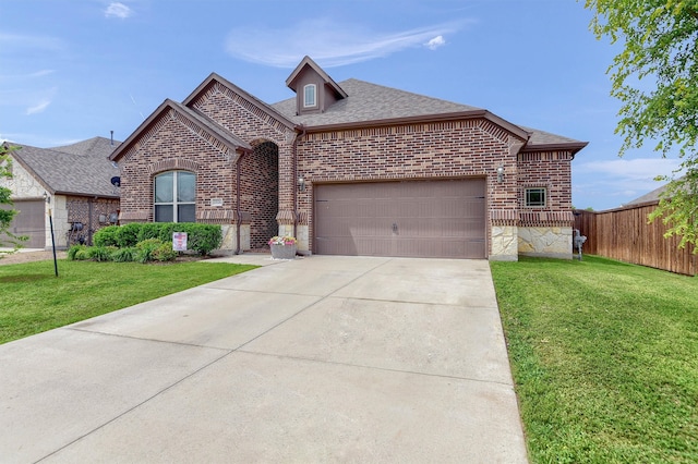 view of front of house with a front lawn and a garage