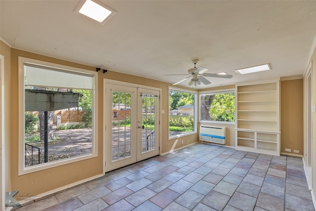 unfurnished sunroom featuring heating unit and ceiling fan