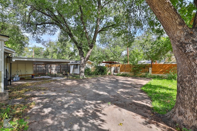 view of yard with a carport