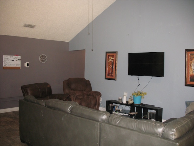 living room with dark wood-type flooring and high vaulted ceiling